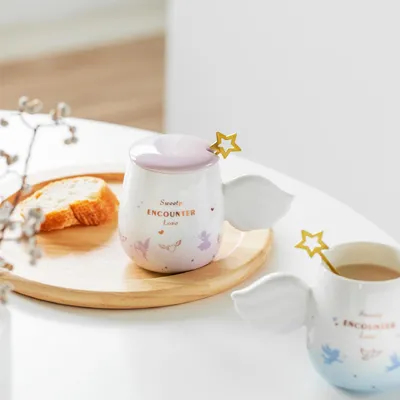 kopen Betoverende Keramische Mok met Engelenvleugel Handvatten & Gouden Ster Roerstaafje Versierd met Zachte Roze & Lichtblauwe Gradiënten online manufacture